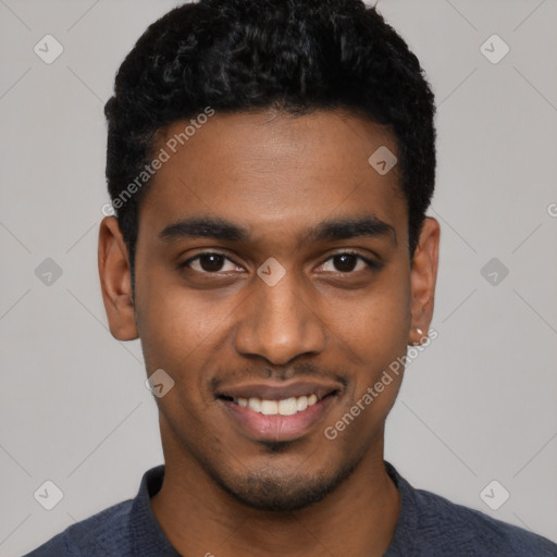 Joyful black young-adult male with short  black hair and brown eyes