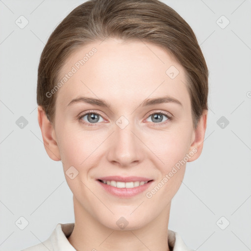 Joyful white young-adult female with short  brown hair and grey eyes