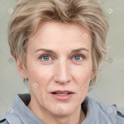 Joyful white adult female with medium  brown hair and blue eyes