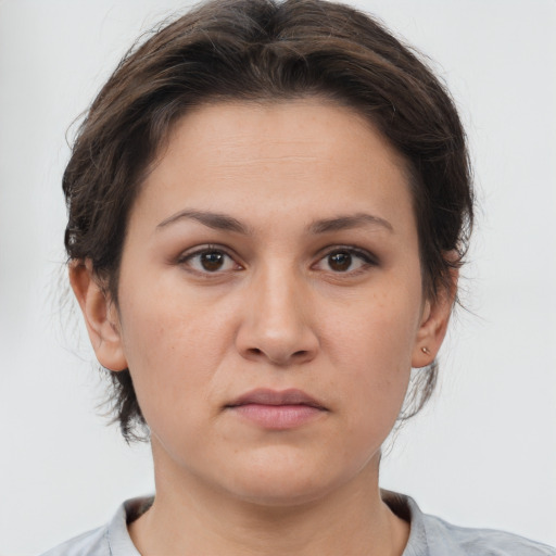 Neutral white young-adult female with short  brown hair and brown eyes