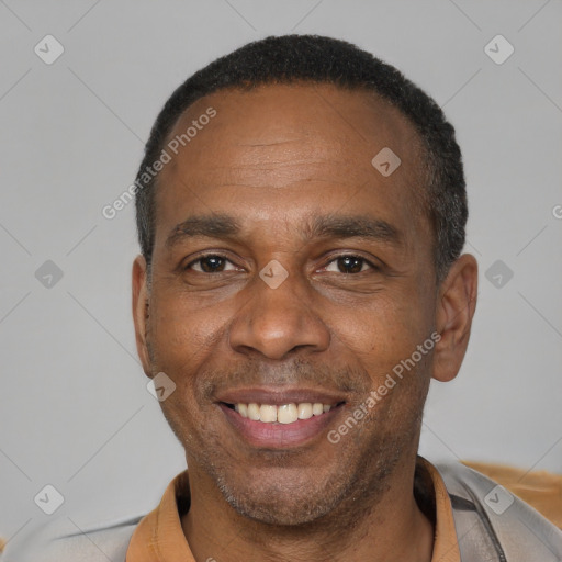 Joyful latino adult male with short  black hair and brown eyes