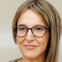 Joyful white adult female with long  brown hair and brown eyes