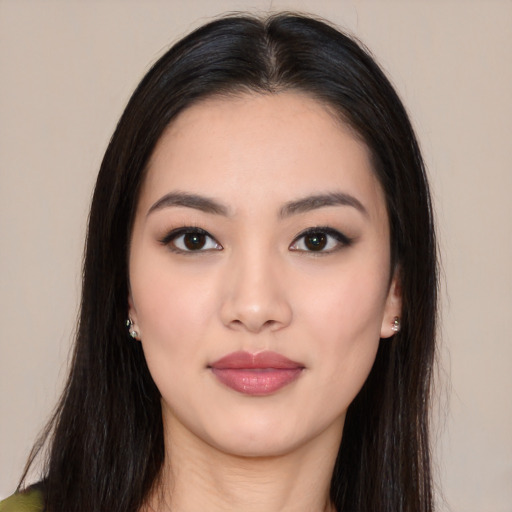 Joyful asian young-adult female with long  black hair and brown eyes