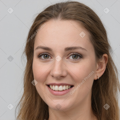 Joyful white young-adult female with long  brown hair and grey eyes