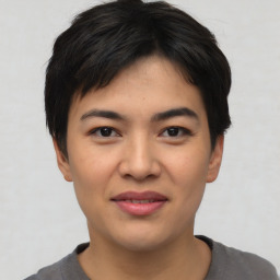 Joyful asian young-adult female with short  black hair and brown eyes