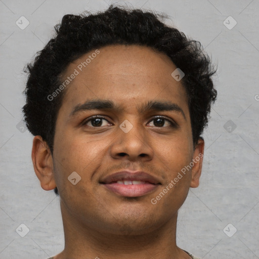 Joyful black young-adult male with short  brown hair and brown eyes