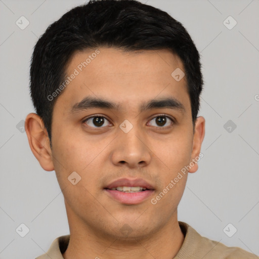 Joyful latino young-adult male with short  black hair and brown eyes