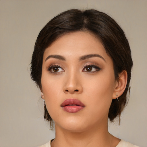 Neutral asian young-adult female with medium  brown hair and brown eyes