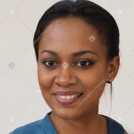 Joyful black young-adult female with medium  brown hair and brown eyes