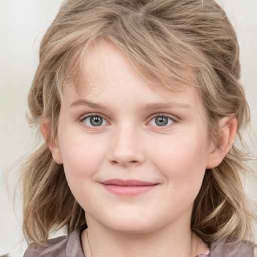 Joyful white child female with medium  brown hair and grey eyes