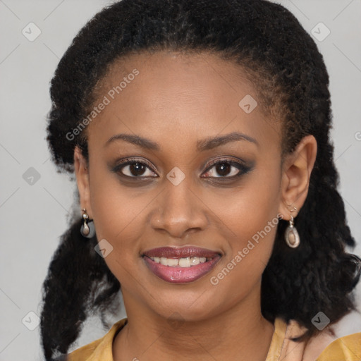 Joyful black young-adult female with long  brown hair and brown eyes