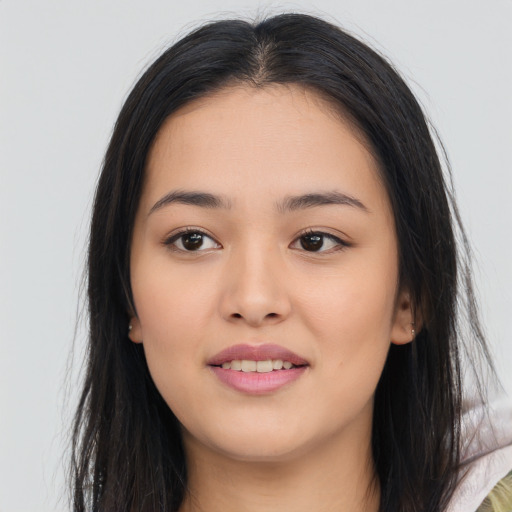 Joyful asian young-adult female with long  brown hair and brown eyes