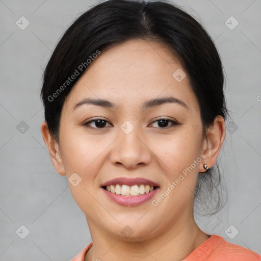 Joyful asian young-adult female with short  black hair and brown eyes