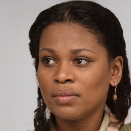 Joyful black young-adult female with medium  brown hair and brown eyes