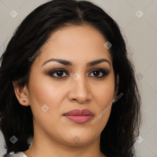 Joyful latino young-adult female with long  brown hair and brown eyes