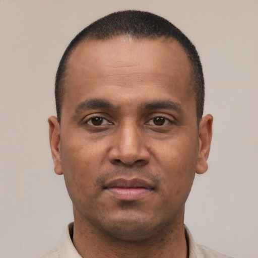 Neutral latino young-adult male with short  brown hair and brown eyes