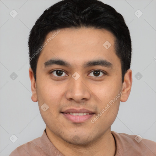 Joyful latino young-adult male with short  black hair and brown eyes