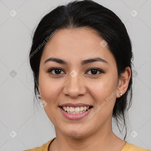 Joyful latino young-adult female with medium  brown hair and brown eyes