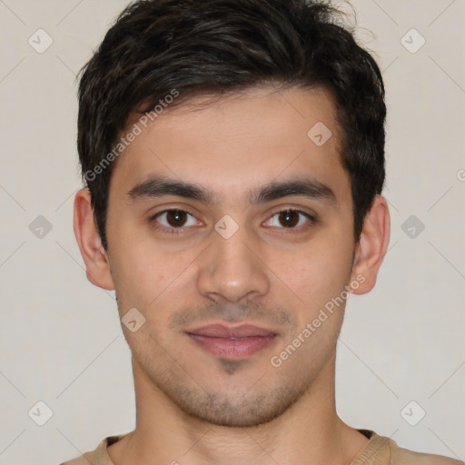 Joyful latino young-adult male with short  brown hair and brown eyes