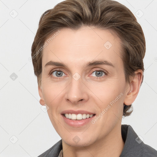 Joyful white young-adult female with short  brown hair and grey eyes