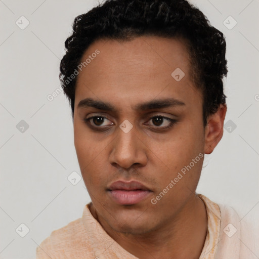 Neutral latino young-adult male with short  black hair and brown eyes