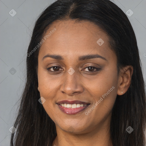 Joyful latino young-adult female with long  brown hair and brown eyes