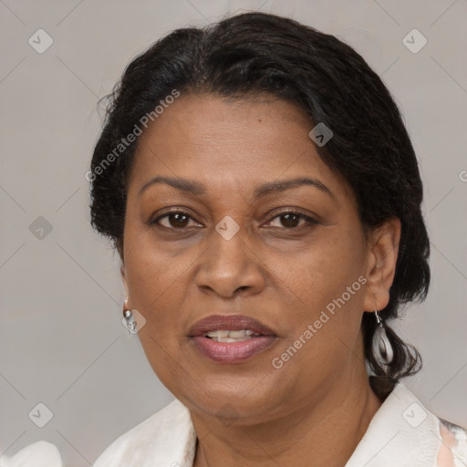 Joyful latino adult female with medium  brown hair and brown eyes