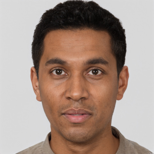 Neutral black adult male with short  black hair and brown eyes