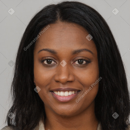 Joyful black young-adult female with long  brown hair and brown eyes