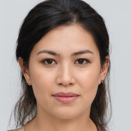 Joyful asian young-adult female with medium  brown hair and brown eyes