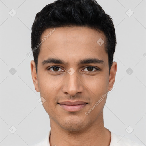 Joyful latino young-adult male with short  black hair and brown eyes