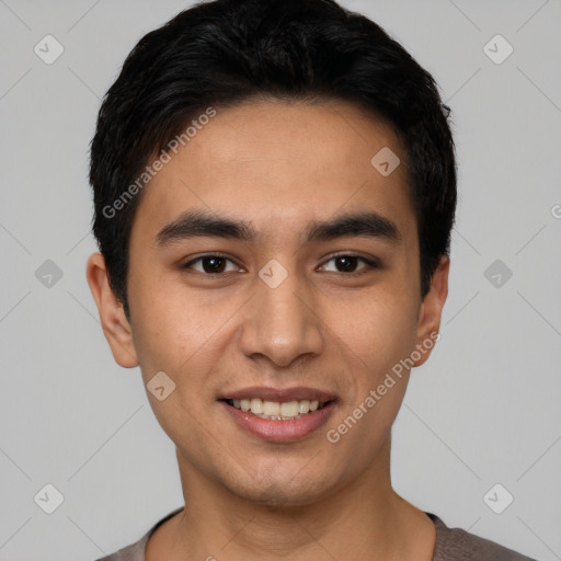 Joyful latino young-adult male with short  black hair and brown eyes