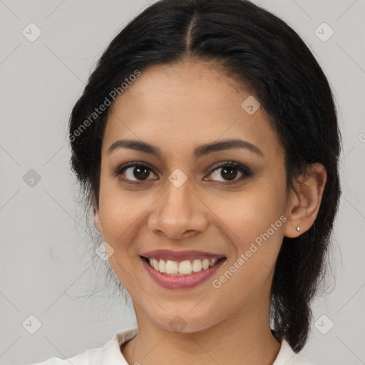 Joyful latino young-adult female with medium  brown hair and brown eyes