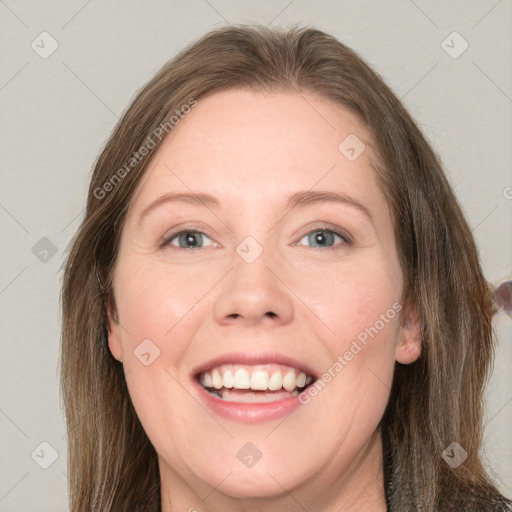 Joyful white adult female with long  brown hair and grey eyes