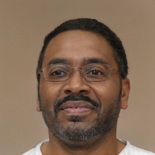 Neutral black adult male with short  black hair and brown eyes