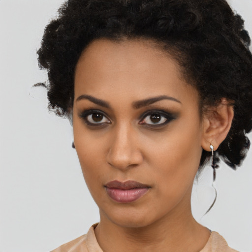 Neutral black young-adult female with short  brown hair and brown eyes