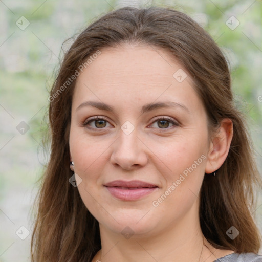 Joyful white young-adult female with medium  brown hair and green eyes