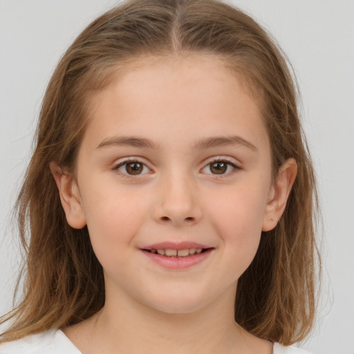 Joyful white child female with medium  brown hair and brown eyes