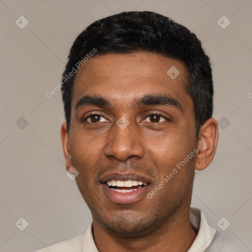 Joyful black young-adult male with short  black hair and brown eyes
