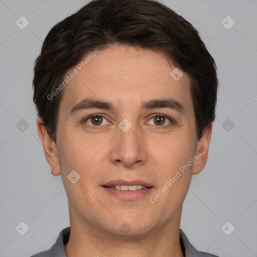 Joyful white adult male with short  brown hair and brown eyes