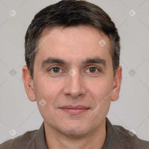 Joyful white adult male with short  brown hair and brown eyes