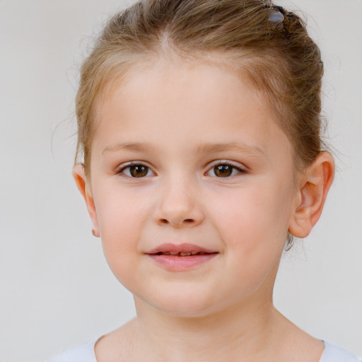 Joyful white child female with short  brown hair and brown eyes