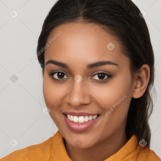 Joyful latino young-adult female with long  brown hair and brown eyes