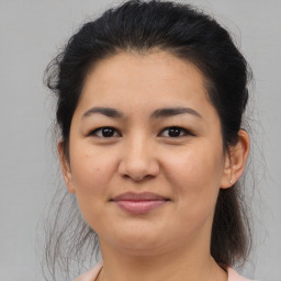 Joyful asian young-adult female with medium  brown hair and brown eyes