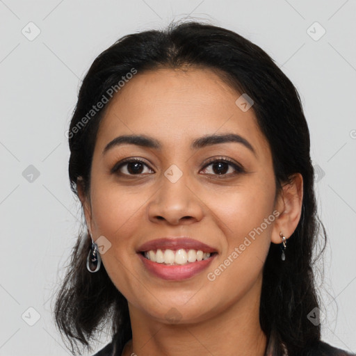 Joyful latino young-adult female with long  black hair and brown eyes