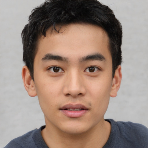 Neutral asian young-adult male with short  brown hair and brown eyes