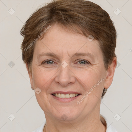 Joyful white adult female with short  brown hair and grey eyes