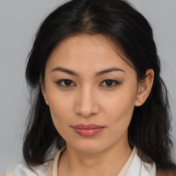 Joyful asian young-adult female with medium  brown hair and brown eyes