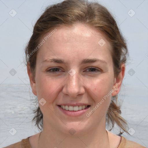 Joyful white young-adult female with medium  brown hair and blue eyes