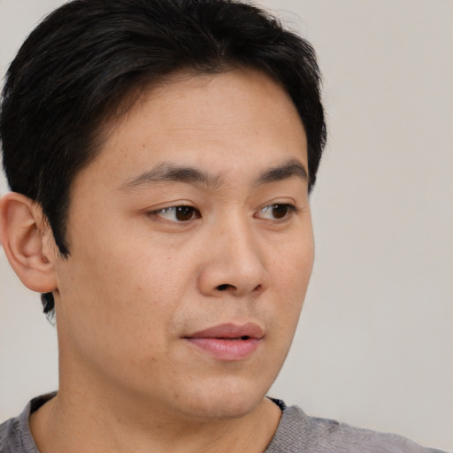 Neutral asian young-adult male with short  brown hair and brown eyes